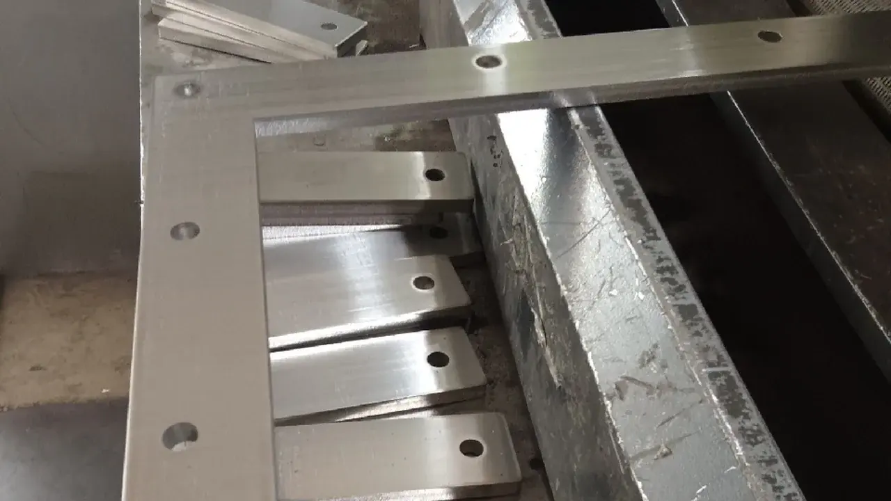 Machined stainless steel assembly with visible finished surfaces