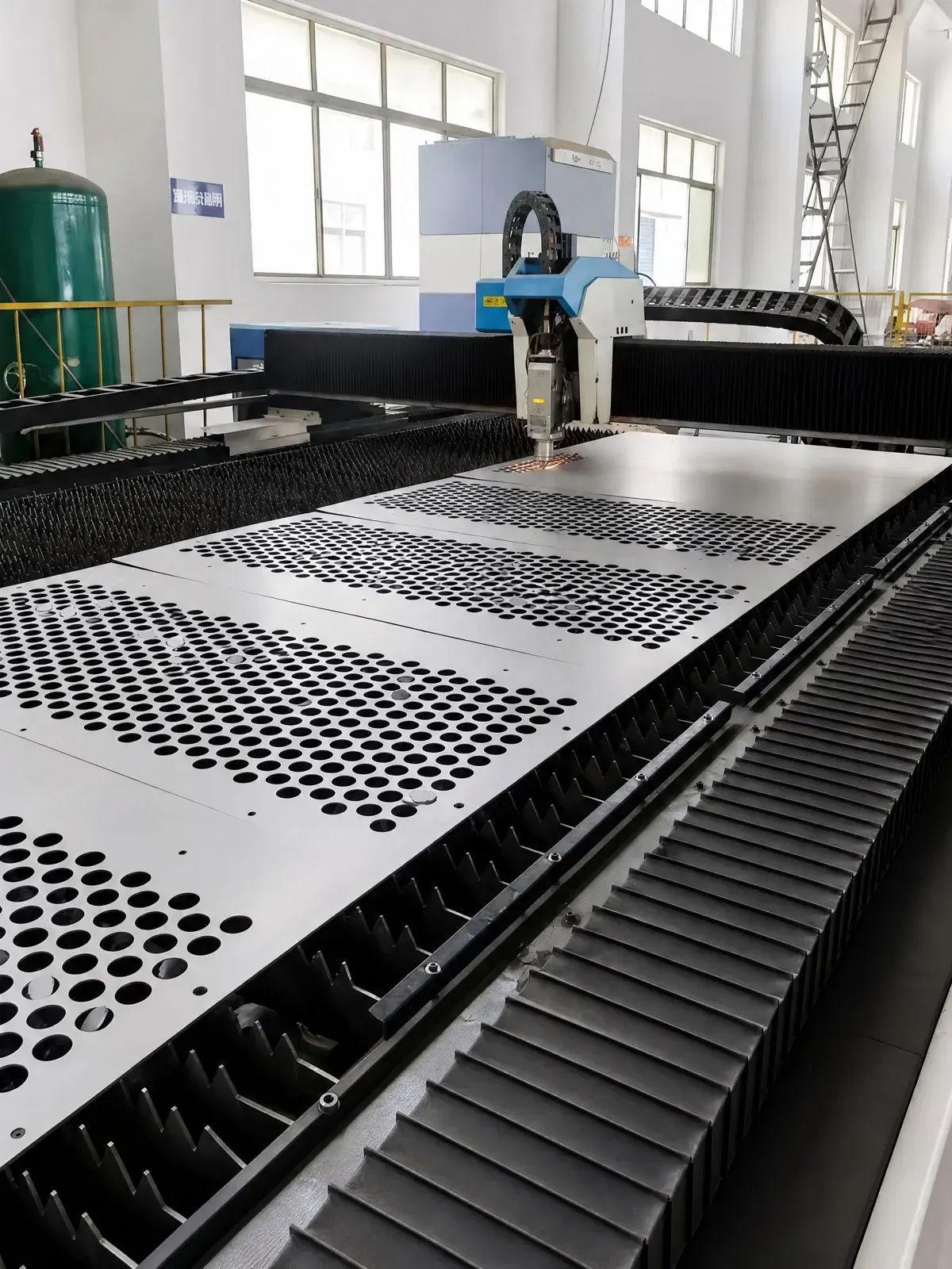 Laser-cut stainless steel sheet during production