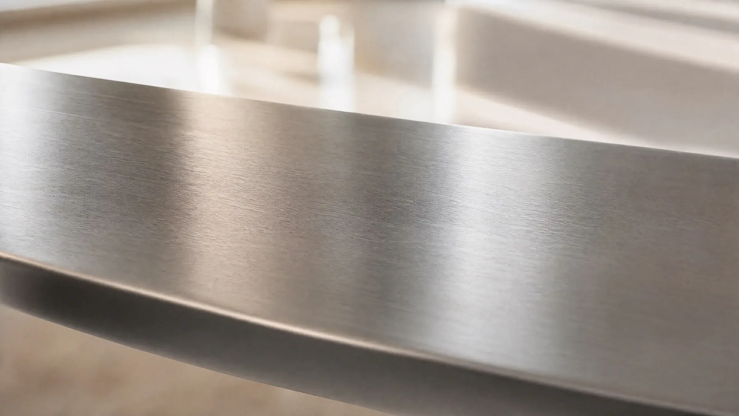 Brushed 304H stainless steel surface in soft natural light