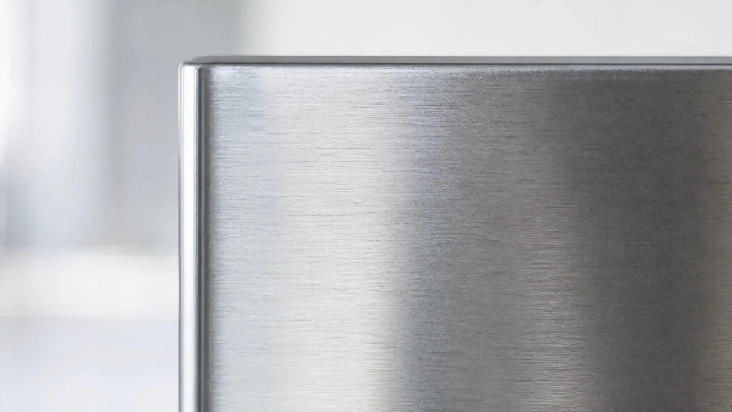 Brushed 410 stainless steel surface in soft natural light