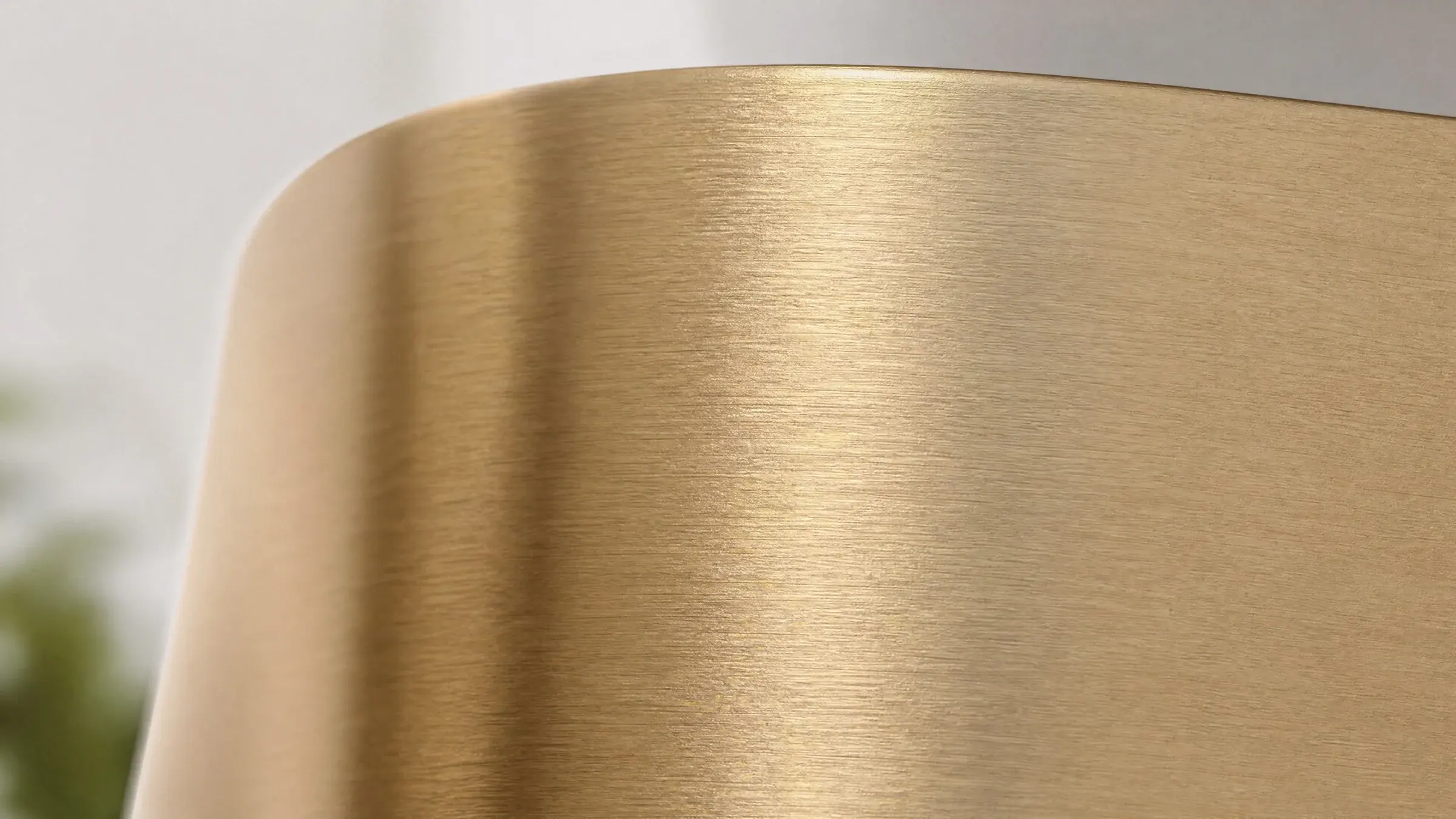 Brushed H62 brass surface in soft natural light