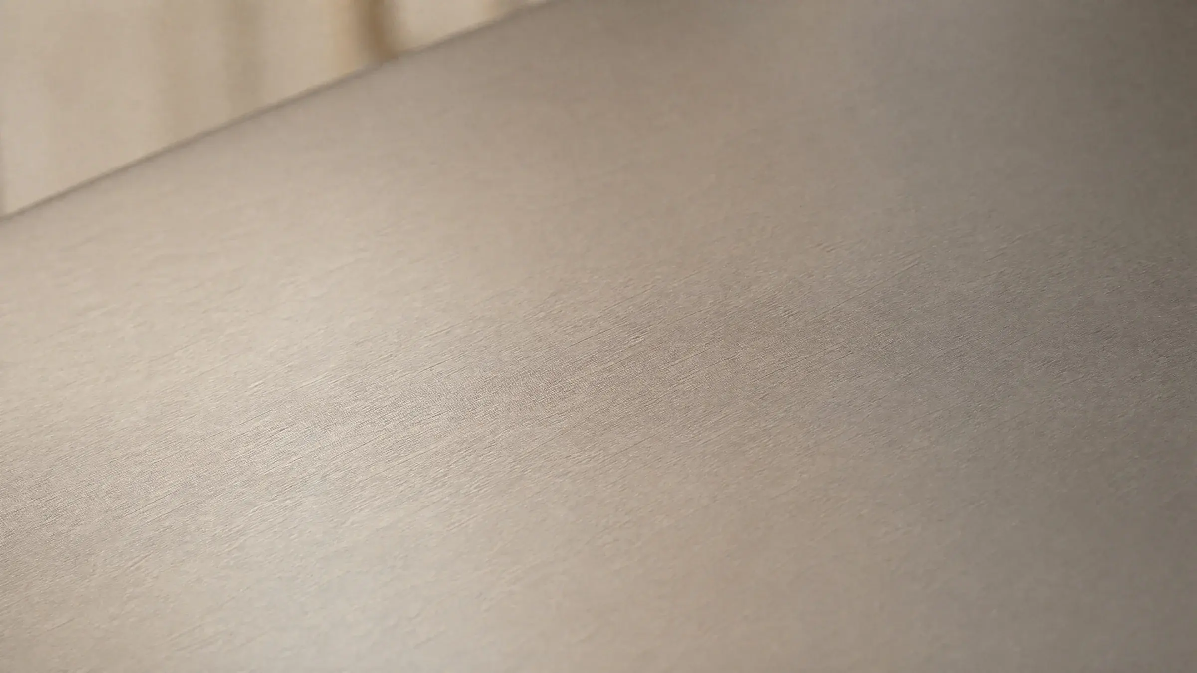 Matte TA2 titanium surface in soft natural light