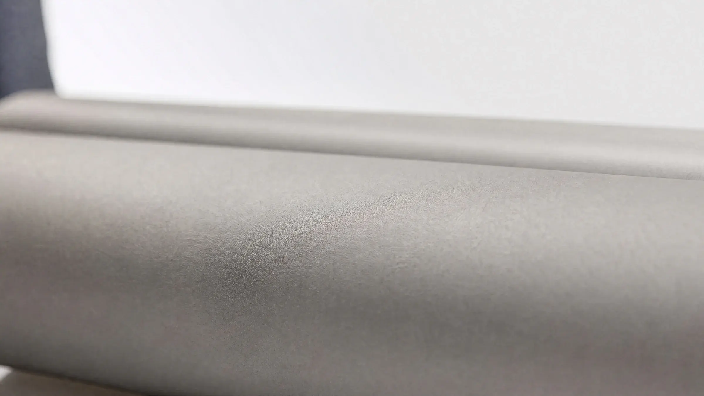 Matte TC4 titanium surface in soft natural light