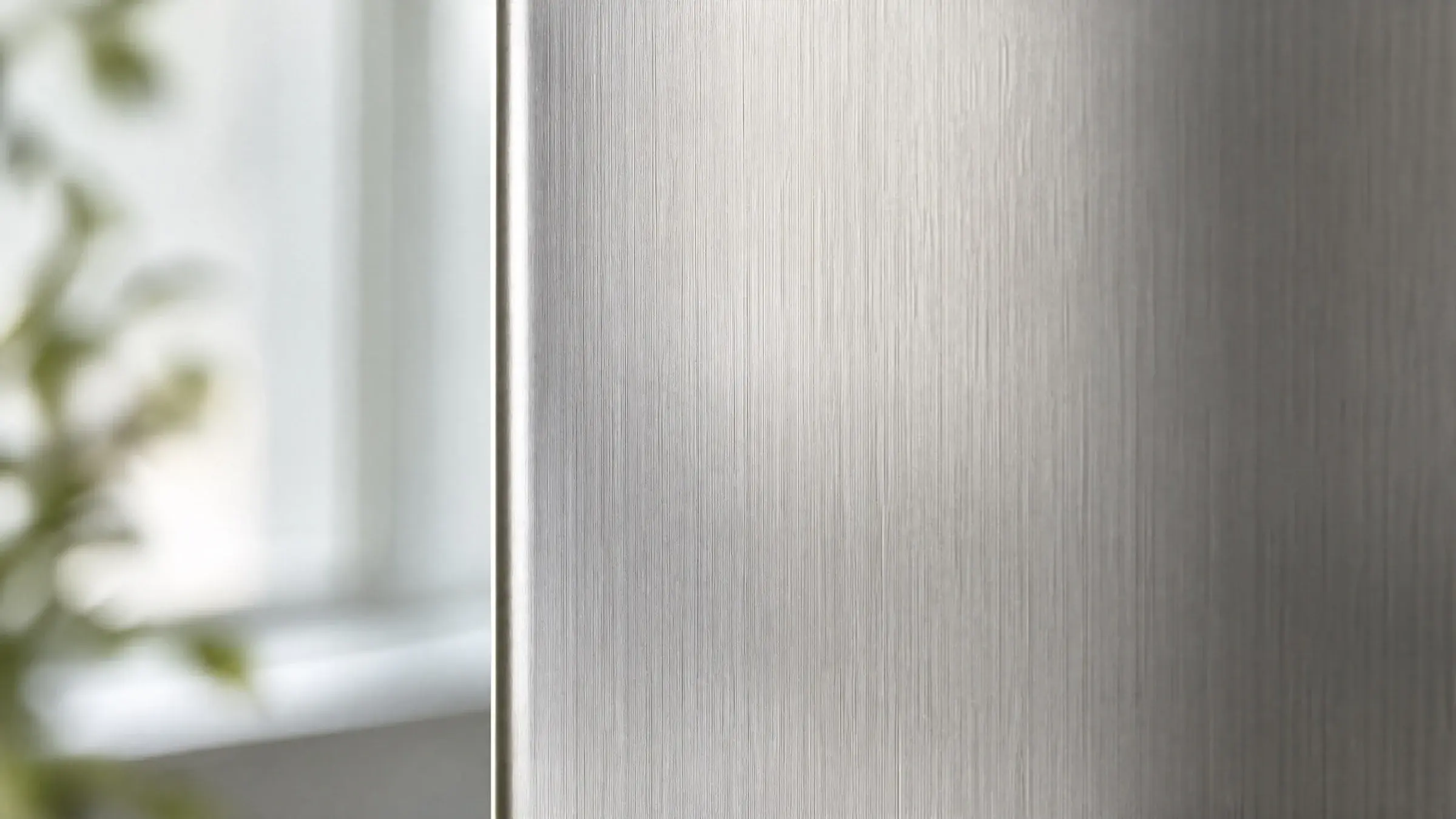 Brushed satin-finish 201 stainless steel decorative panel in soft natural light