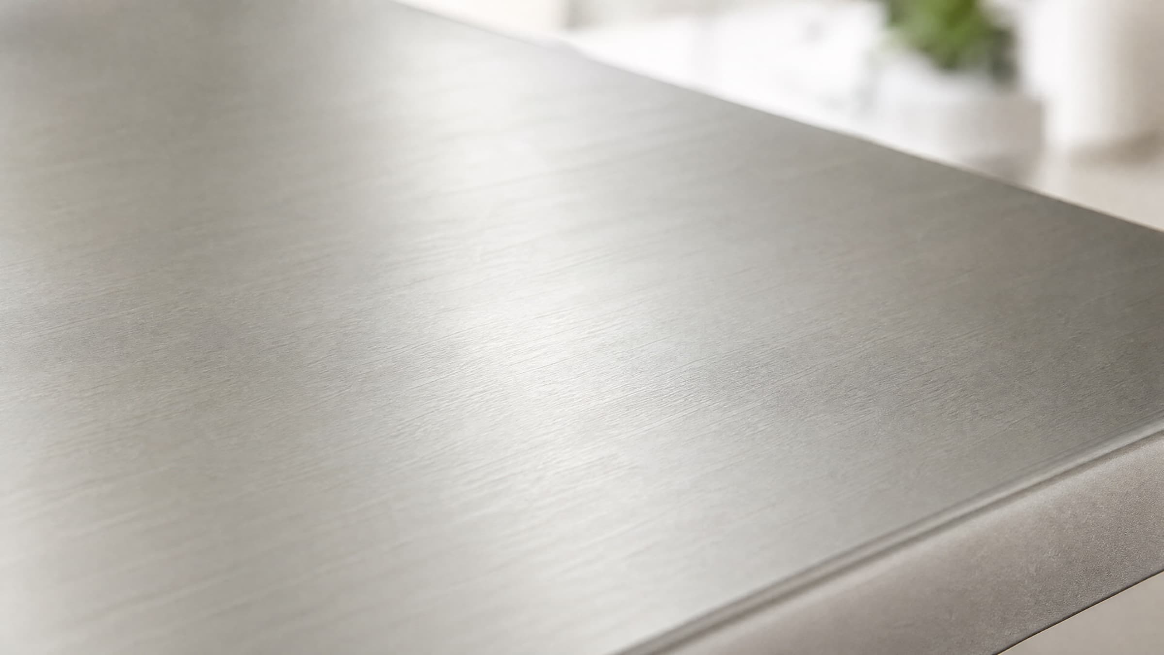 Brushed 2507 stainless steel surface in soft natural light