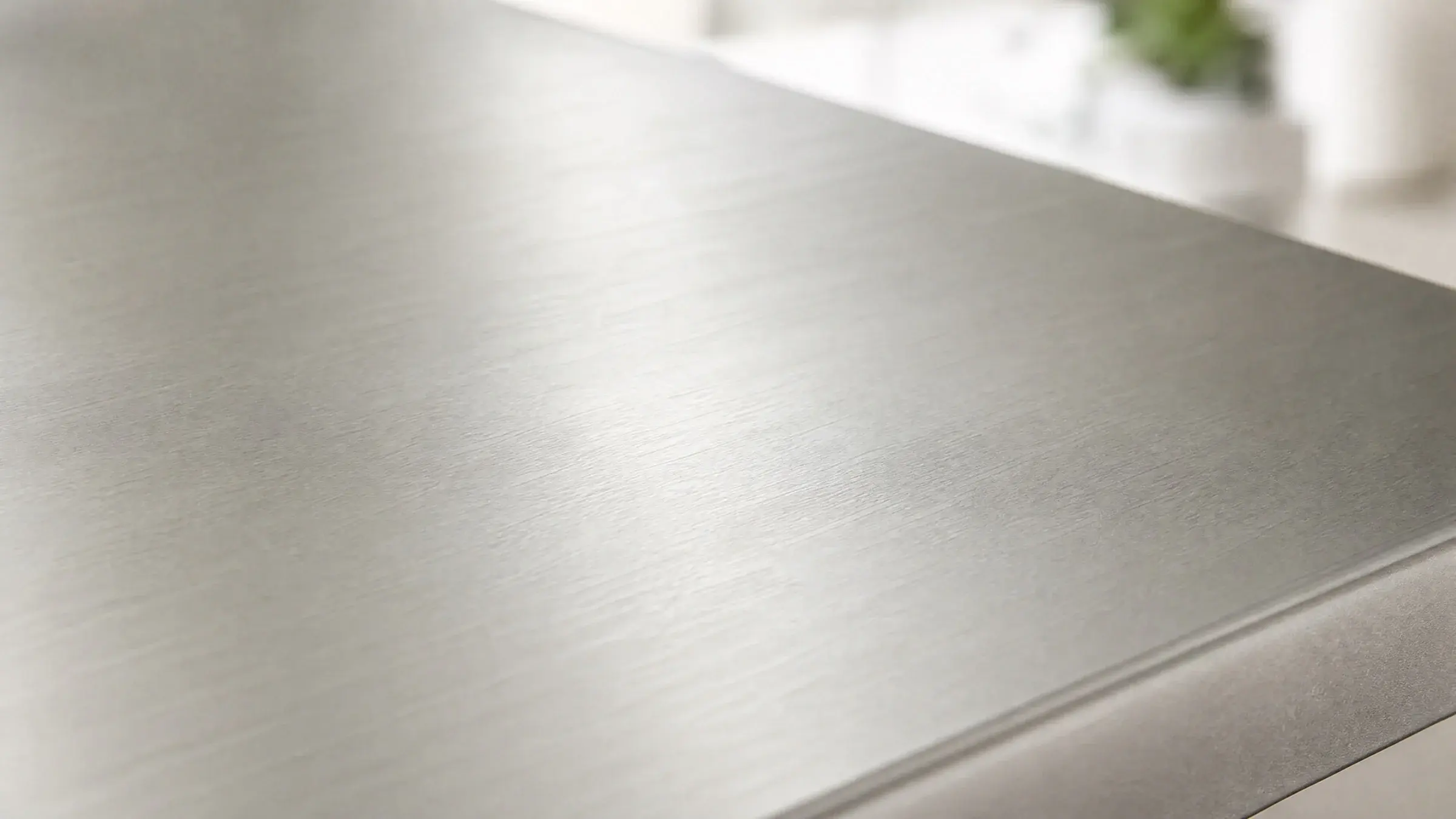 Brushed 2507 stainless steel surface in soft natural light