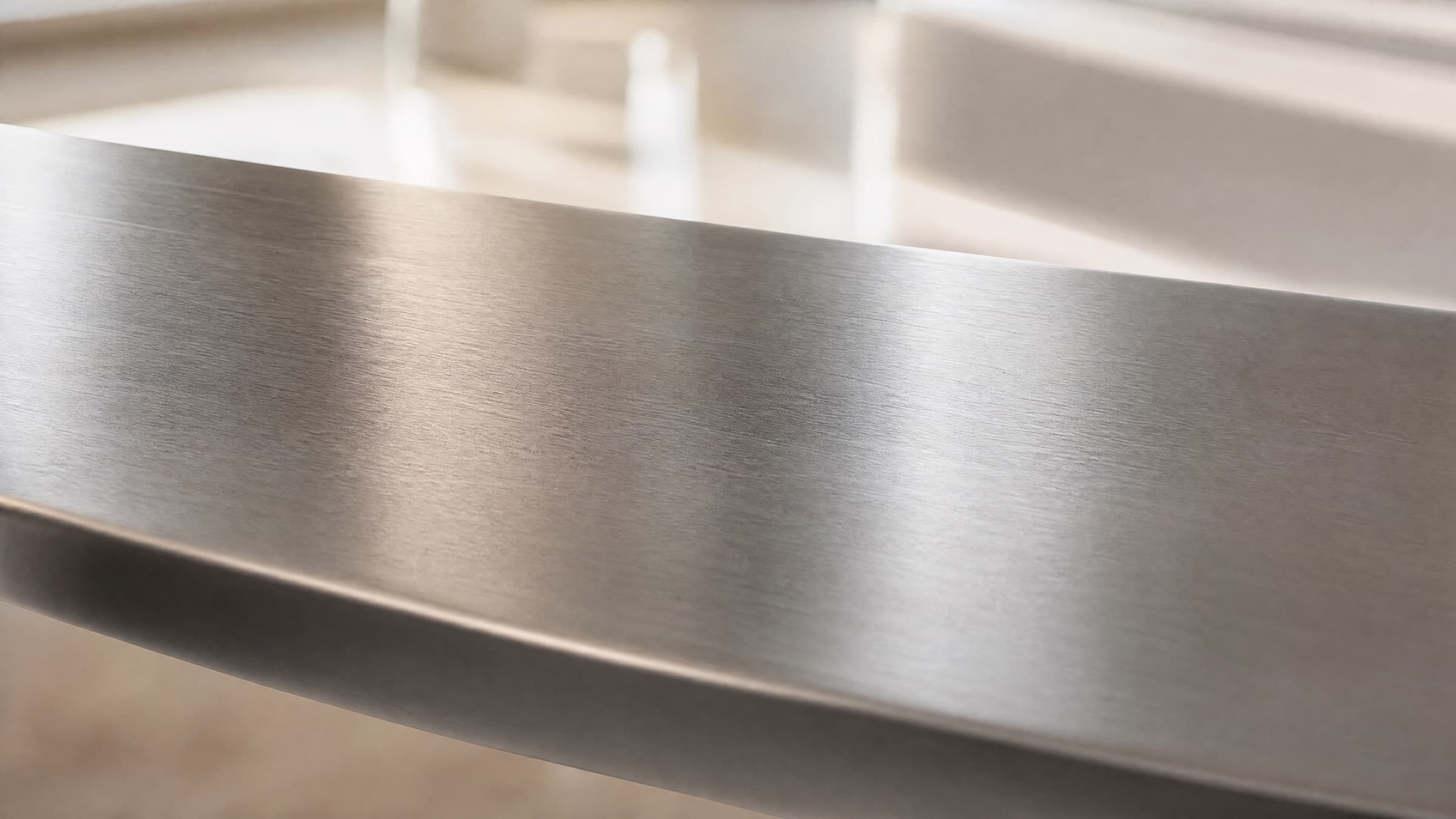 Brushed 304H stainless steel surface in soft natural light