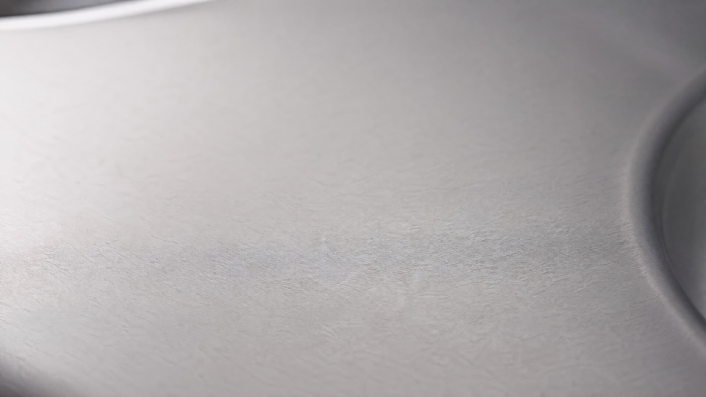 Brushed 310S stainless steel surface in soft natural light