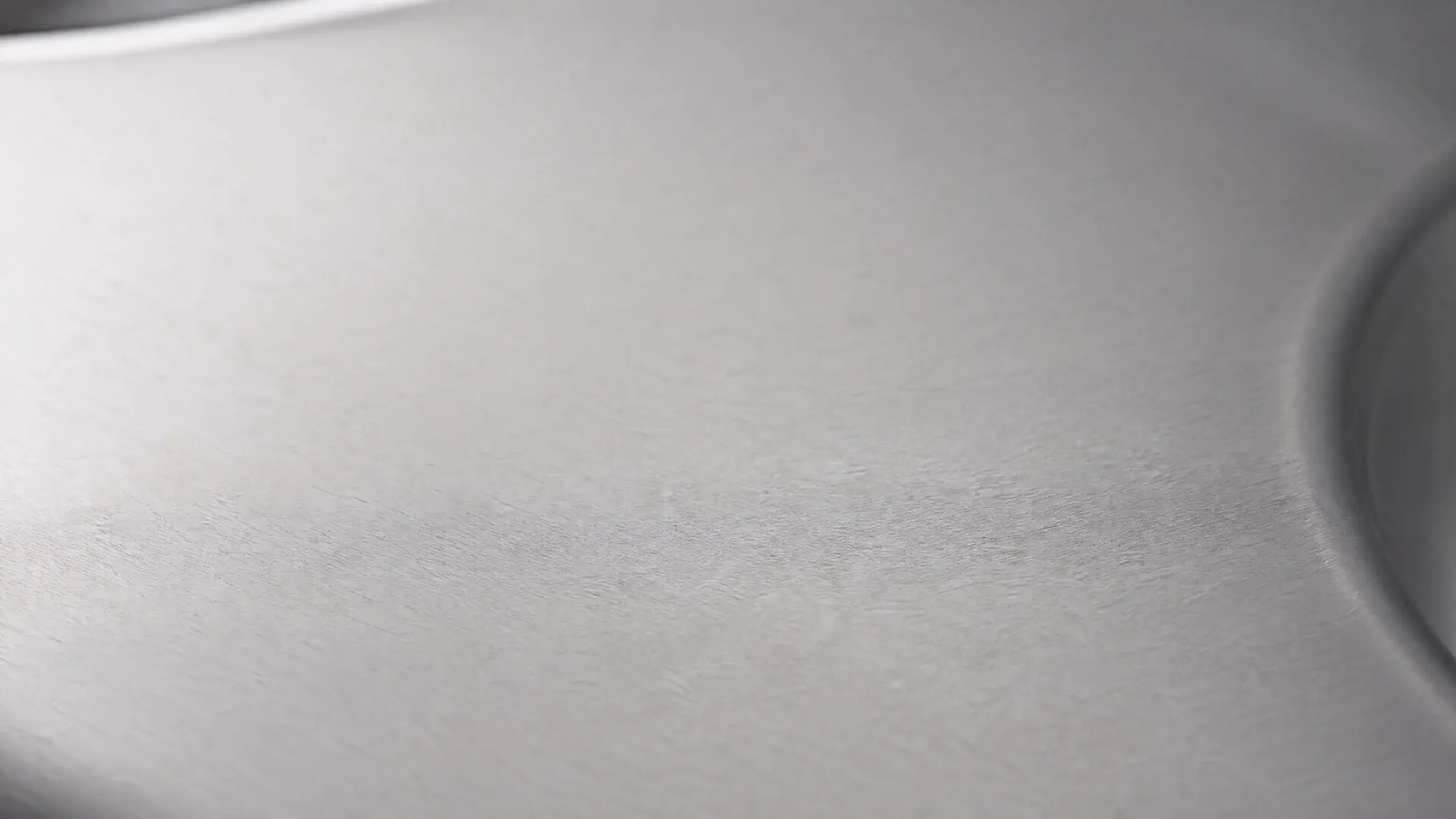 Brushed 310S stainless steel surface in soft natural light