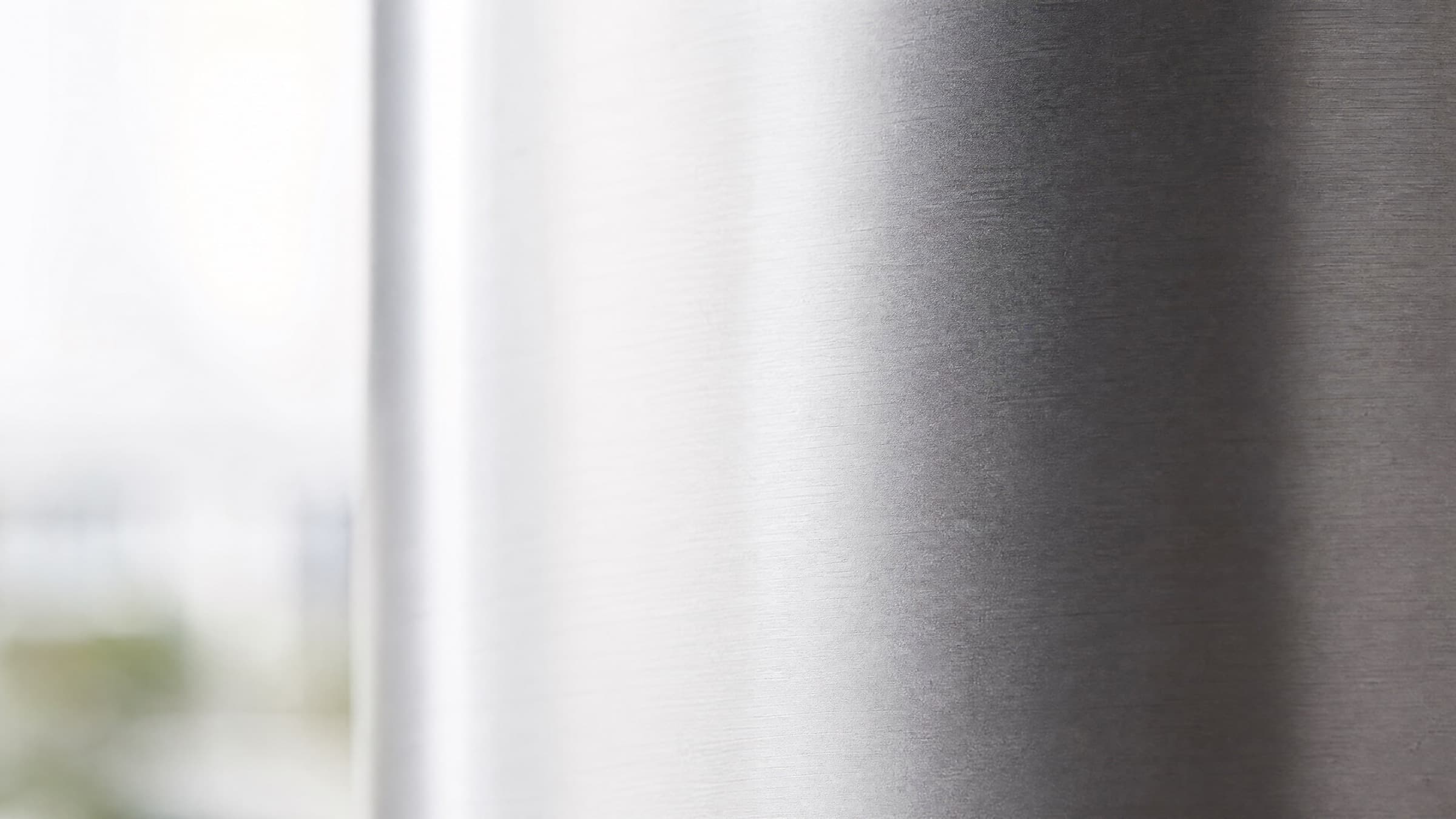 Brushed 409 stainless steel surface in soft natural light