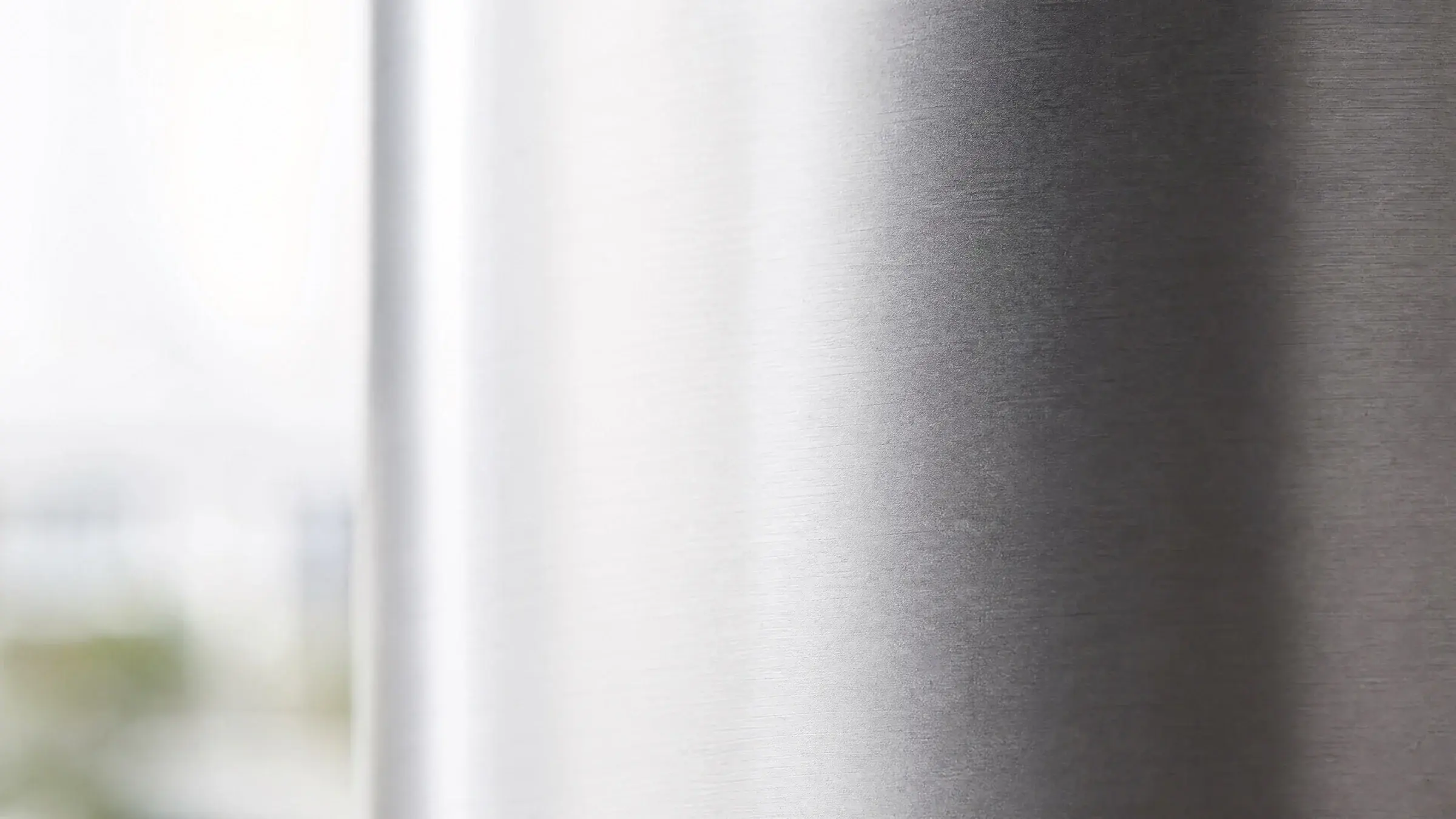 Brushed 409 stainless steel surface in soft natural light