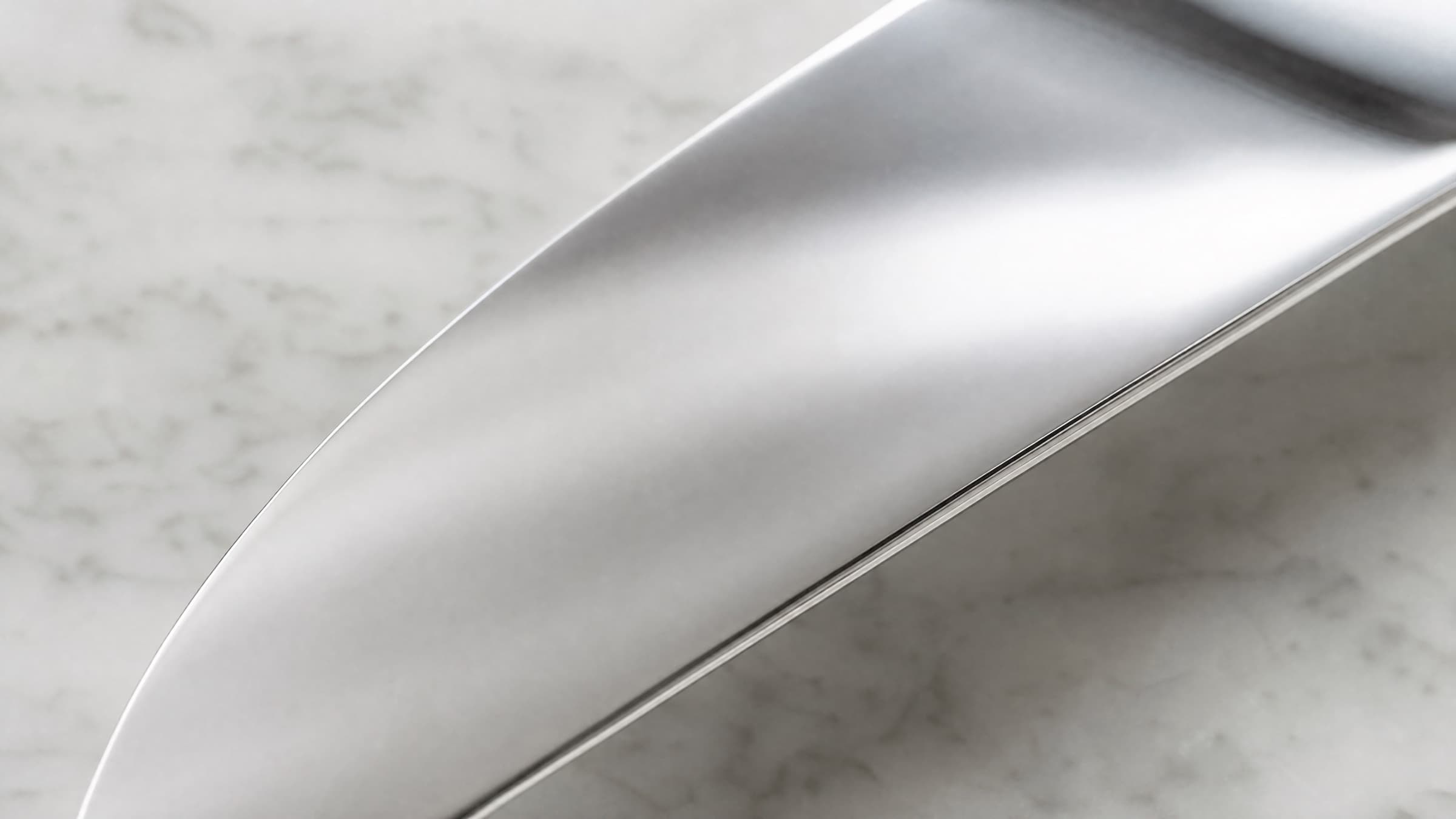 Brushed 420 stainless steel surface in soft natural light