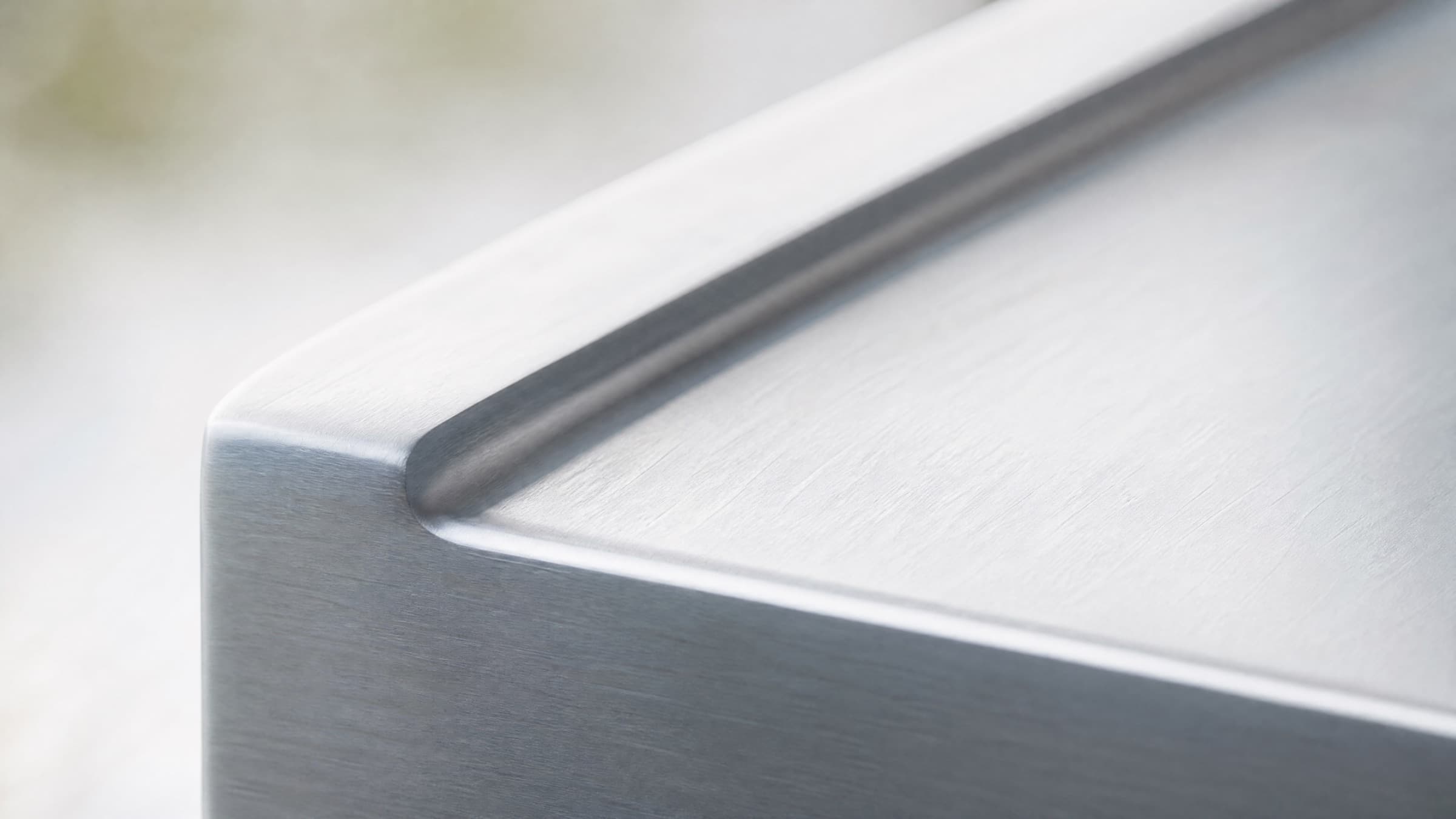 Brushed 5052 aluminium surface in soft natural light
