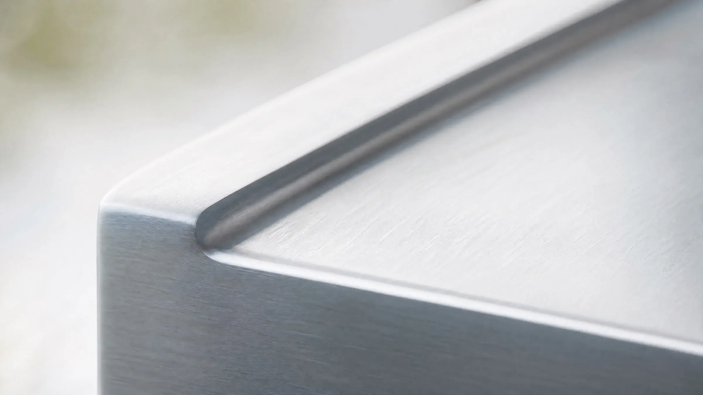 Brushed 5052 aluminium surface in soft natural light