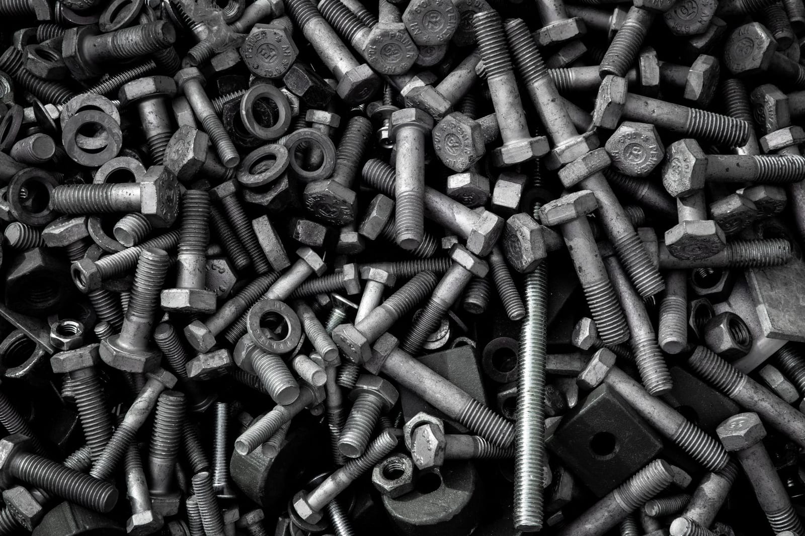 Steel bolts fasteners pile
