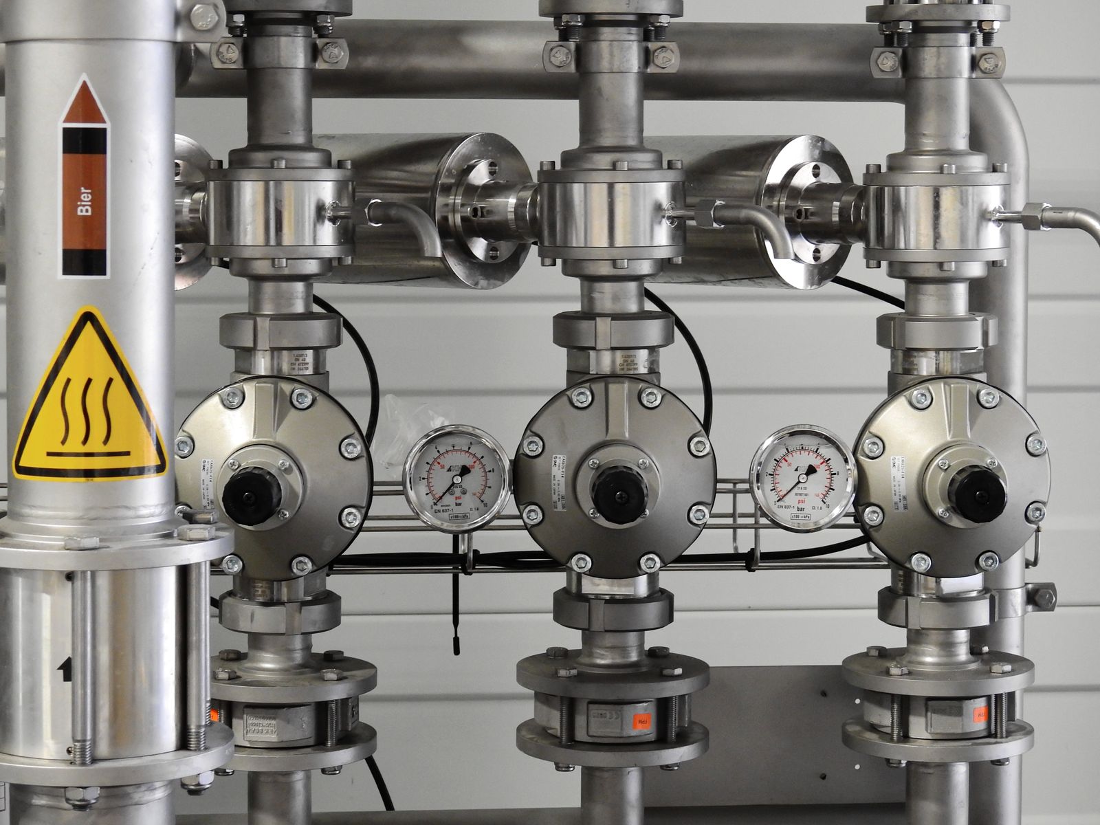 Stainless steel chemical process tanks and piping in an industrial plant