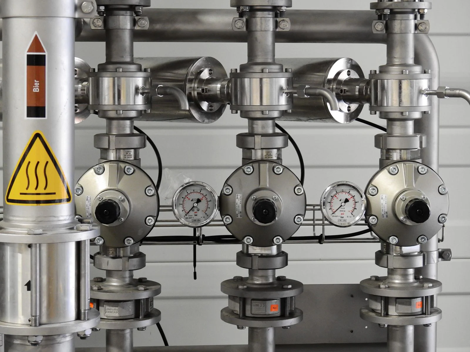 Stainless steel chemical process tanks and piping in an industrial plant
